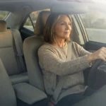 Older woman driving with hands at 9-and-3 — staying safe behind the wheel with peripheral neuropathy