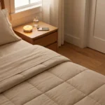 Neuropathy-friendly bedroom setup with motion night light, accessible nightstand, and smooth soft bedding for better sleep