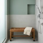 Modern walk-in shower with a non-slip shower bench, handheld showerhead on a slide bar, and properly installed grab bar