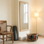 A permanently set up home exercise corner with chair, mat, mirror and resistance bands